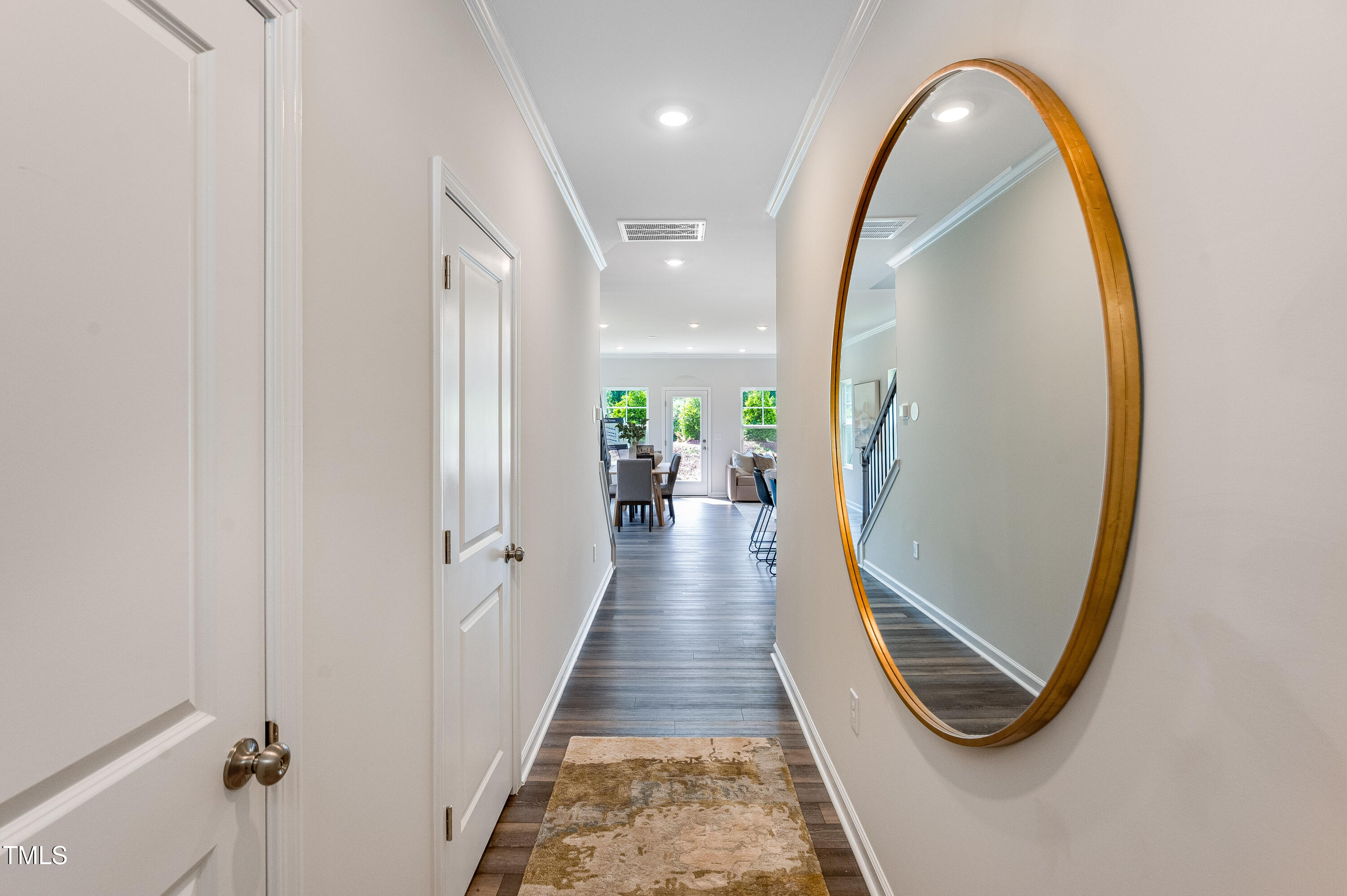 2125 Titanium Rock Road Durham, NC 27704 - Photo 16 of 28 wooden floor with a mirror