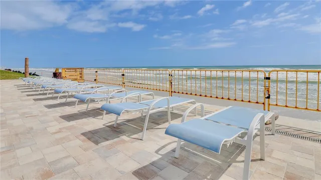 a view of a terrace with chairs