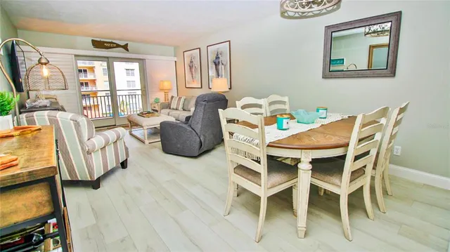 a dining room with furniture and windows