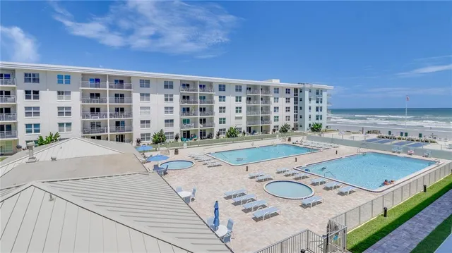 a patio with a table and chairs