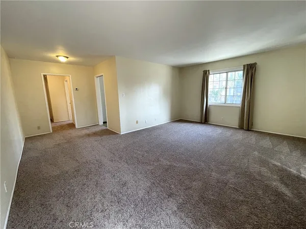 a view of empty room with windows