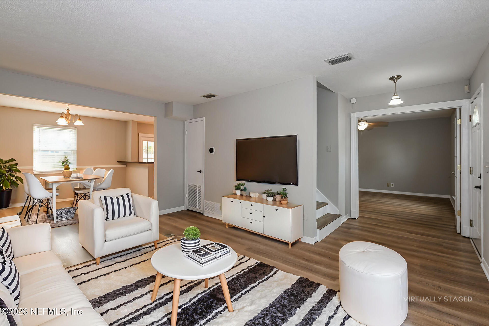 1077 Kings Road Neptune Beach, FL 32266 - Photo 11 of 19 a living room with furniture and a flat screen tv