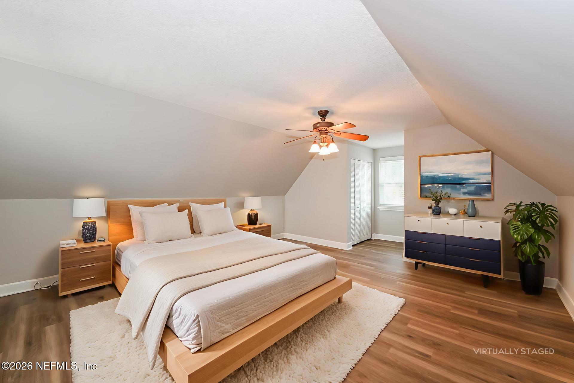 1077 Kings Road Neptune Beach, FL 32266 - Photo 13 of 19 a bed room with a bed and a chandelier