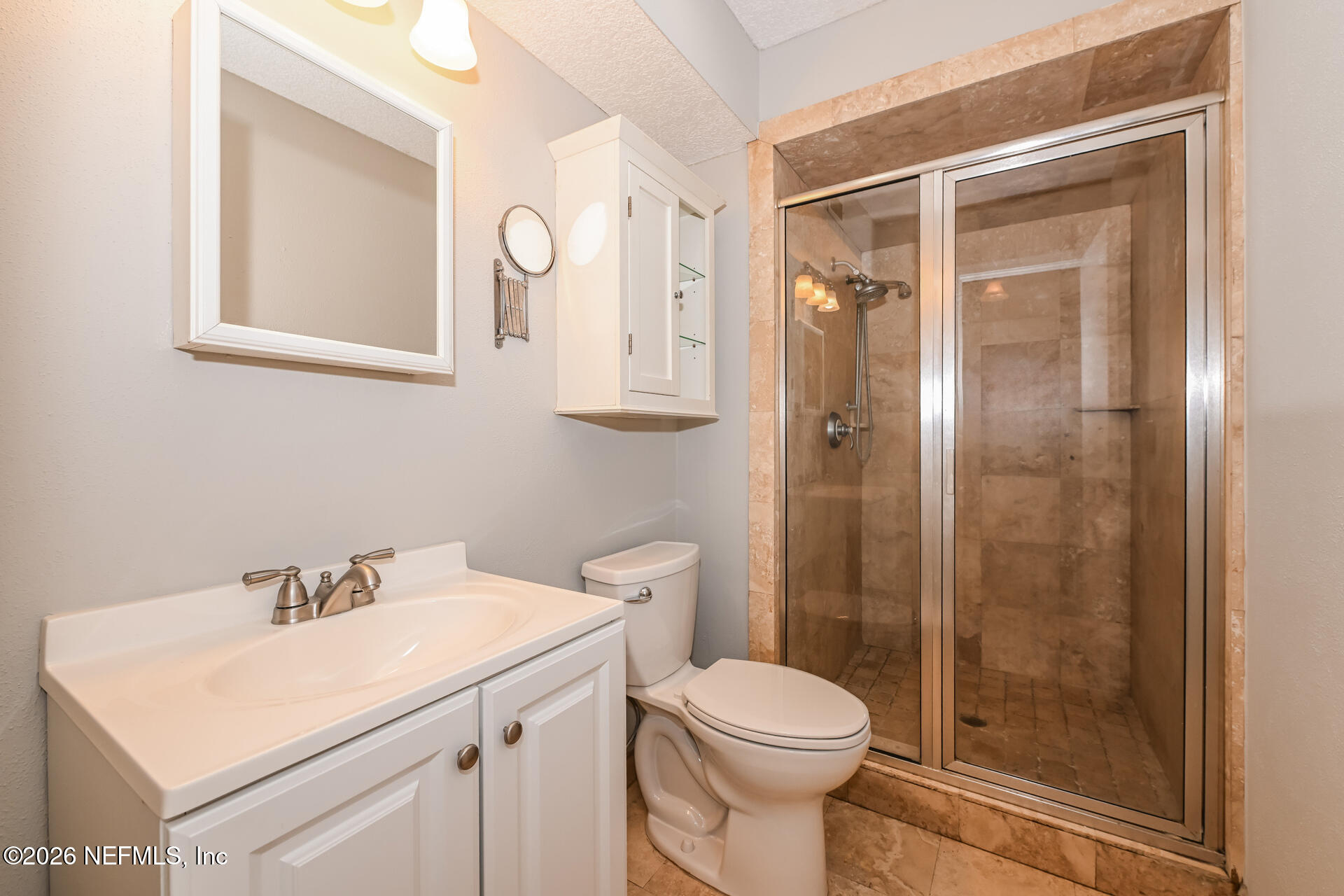 1077 Kings Road Neptune Beach, FL 32266 - Photo 15 of 19 a bathroom with a sink a toilet and shower