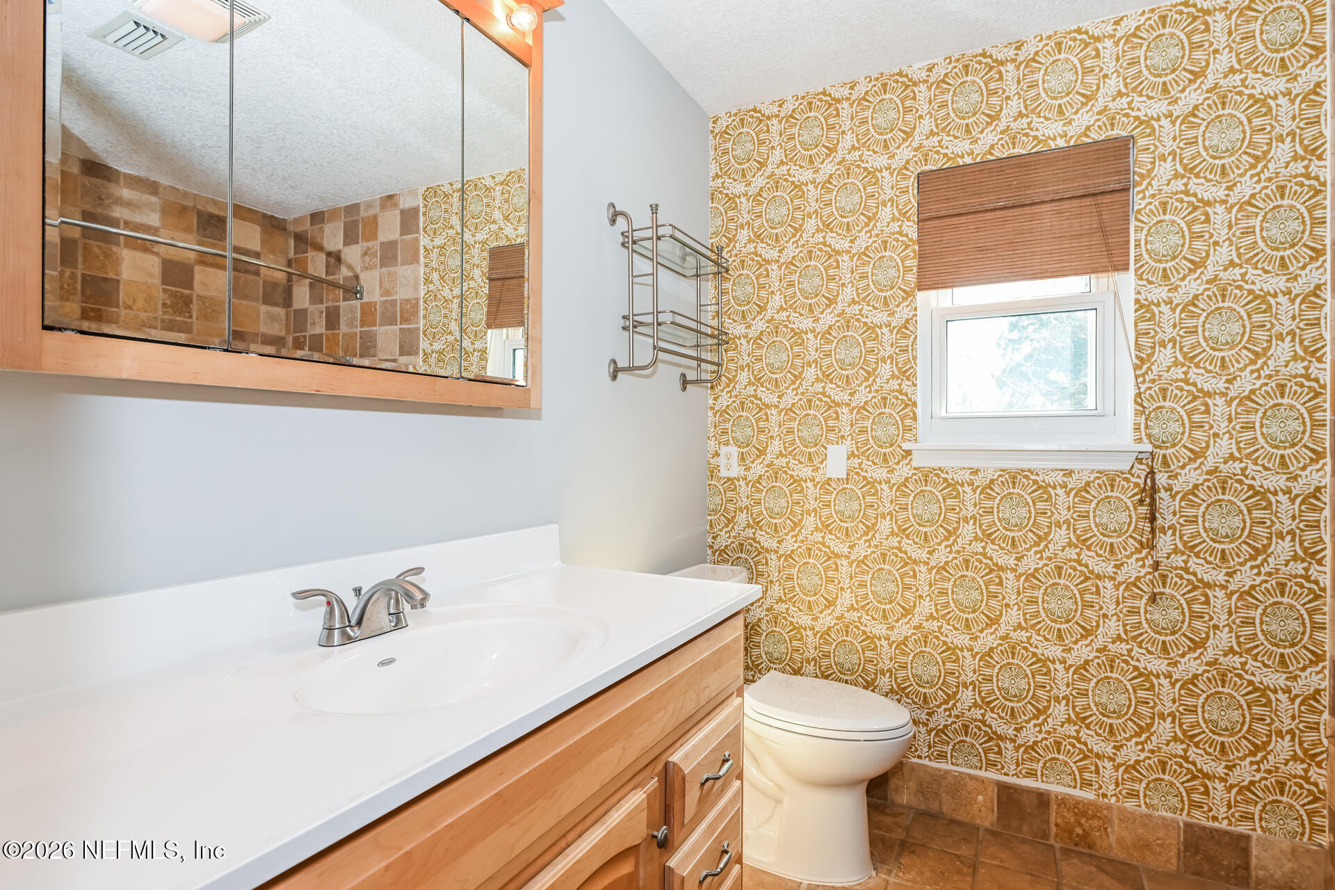 1077 Kings Road Neptune Beach, FL 32266 - Photo 18 of 19 a bathroom with a sink a toilet and shower