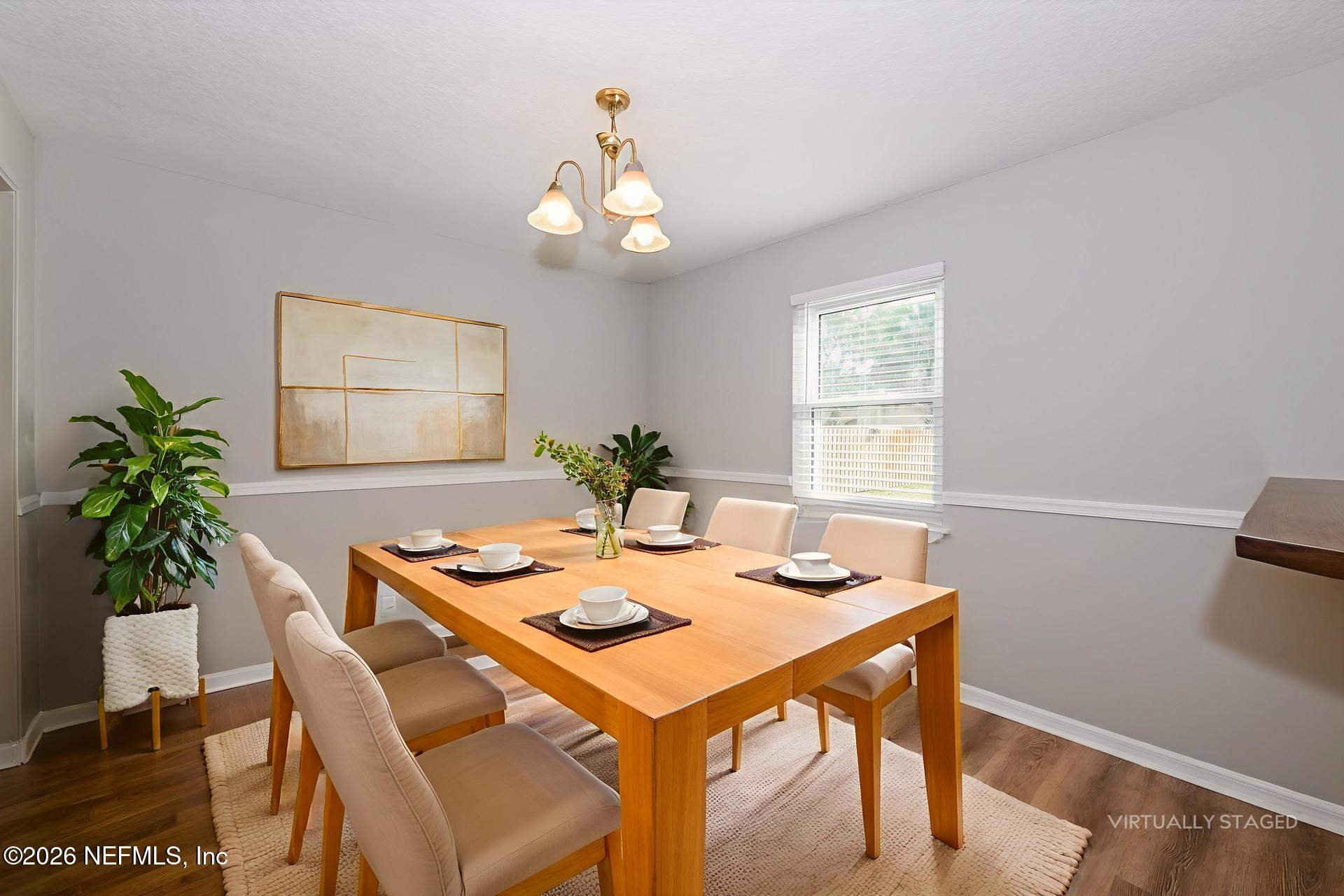 1077 Kings Road Neptune Beach, FL 32266 - Photo 9 of 19 a view of a dining room with furniture and wooden floor
