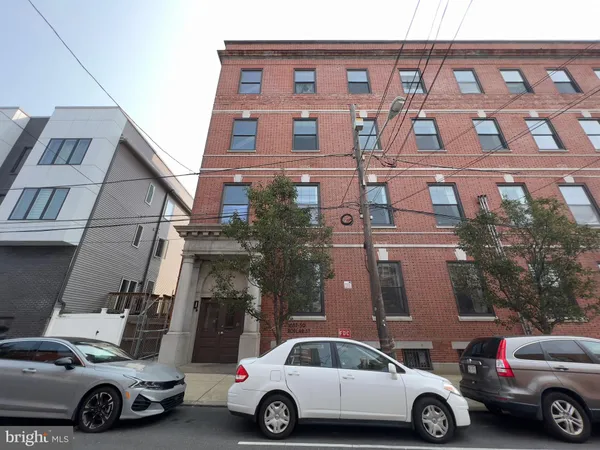 front view of a house with car parked