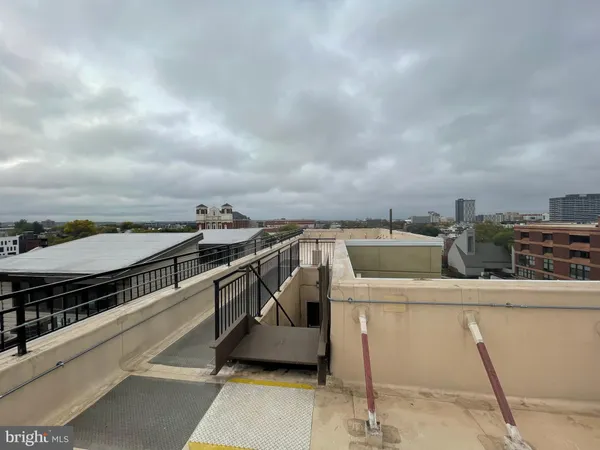 a view of a balcony with chairs