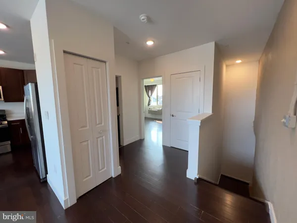 a view of entryway with wooden floor