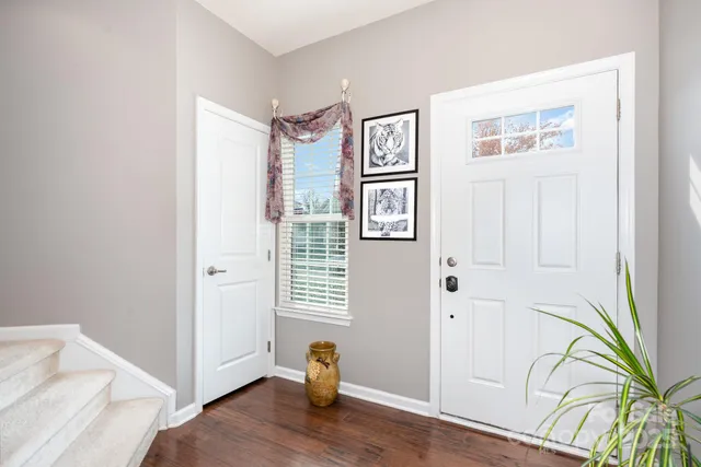 a view of entryway with wooden floor