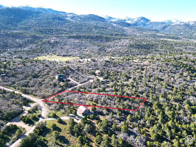 14050 Oak Rdg Circle, Unit 144 Mount Pleasant, UT 84647 - Photo 3 of 28 Aerial view of property and surrounding area featuring property parcel outlined and a mountainous background