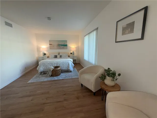 a bedroom with a bed and a couch