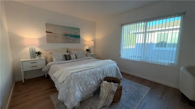 a bedroom with a bed and window