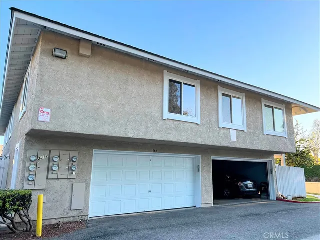 a front view of a house with parking