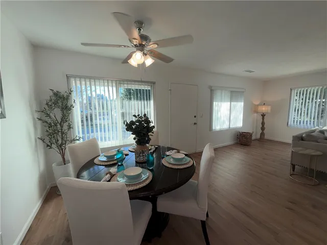 a dining room with furniture a livingroom and chandelier