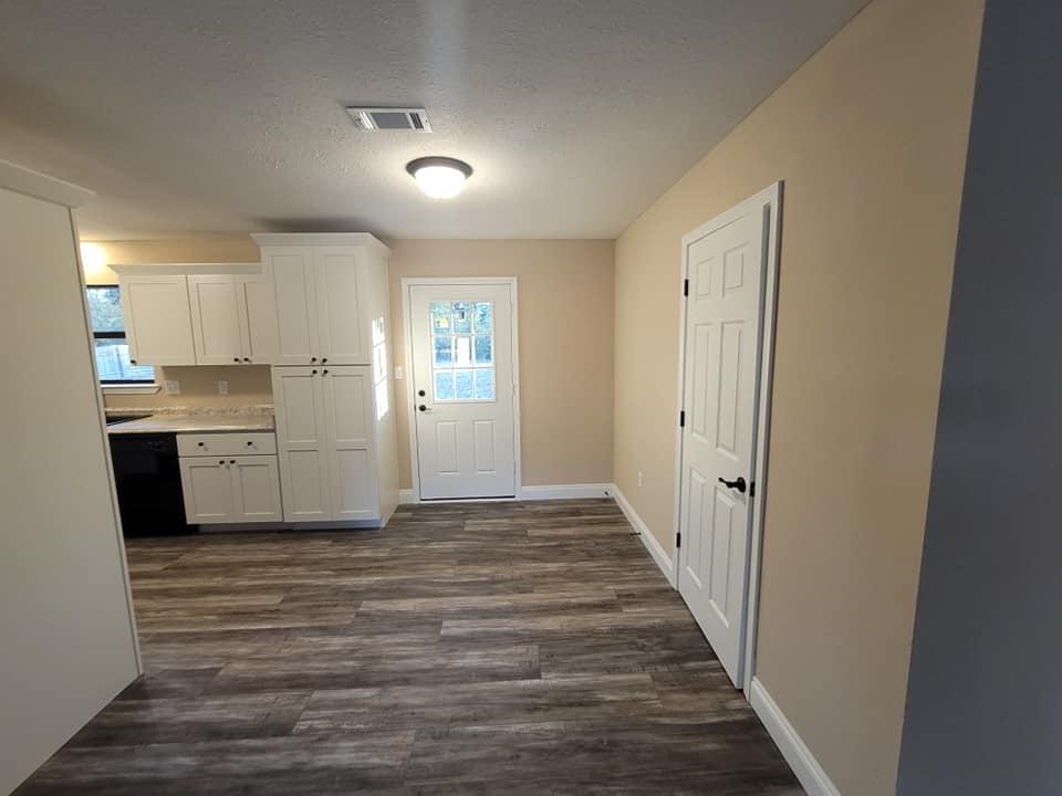 3526 Auburn Road Crestview, FL 32539 - Photo 4 of 11 a view of a kitchen with wooden floor and electronic appliances