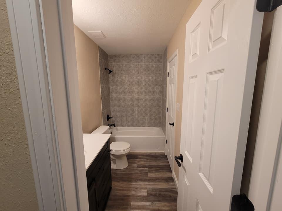 3526 Auburn Road Crestview, FL 32539 - Photo 9 of 11 a bathroom with a sink toilet and shower