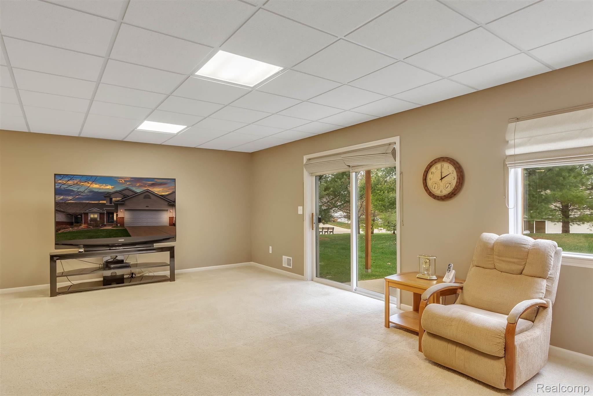 484 Hosta Howell, MI 48843 - Photo 6 of 33 With all this natural light, you will never know you're in a finished basement. Sliding glass door out to your patio