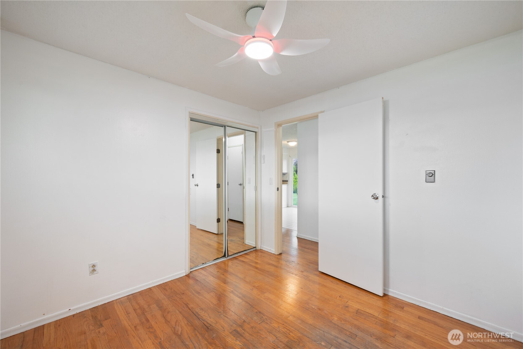 359 Douglas Street Longview, WA 98632 - Photo 19 of 29 a view of an empty room with wooden floor