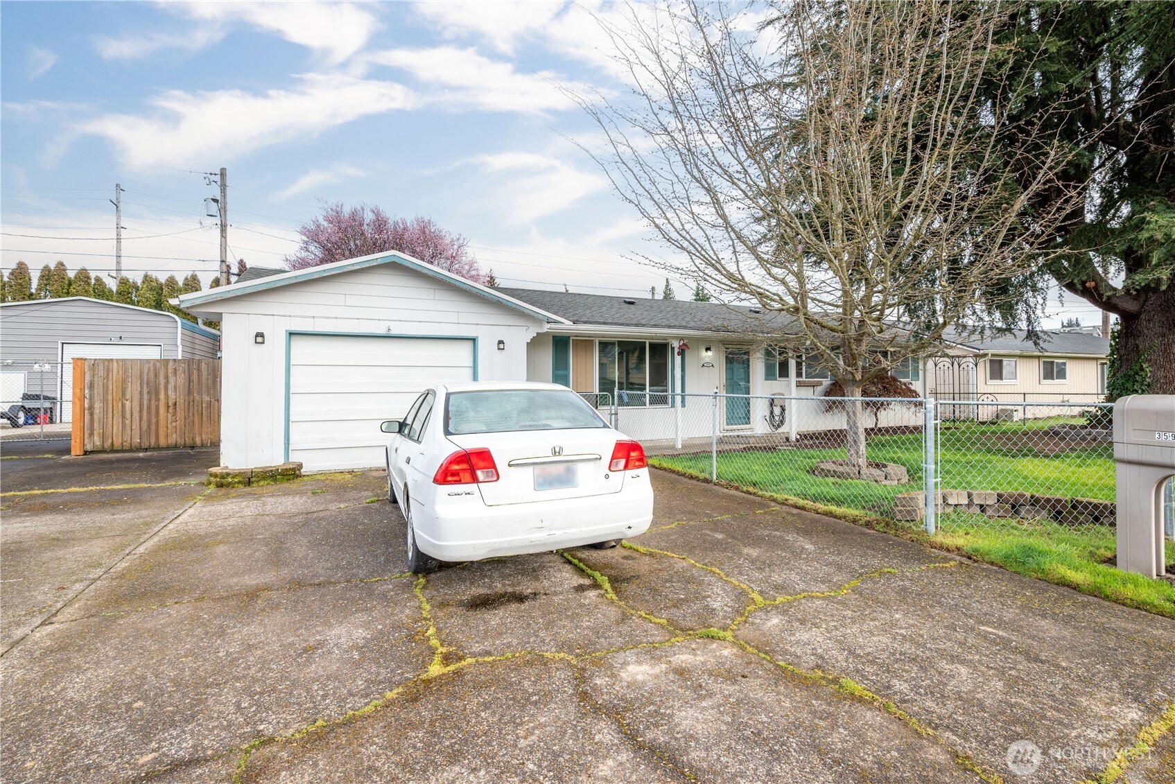 359 Douglas Street Longview, WA 98632 - Photo 2 of 29 a front view of a house with a yard