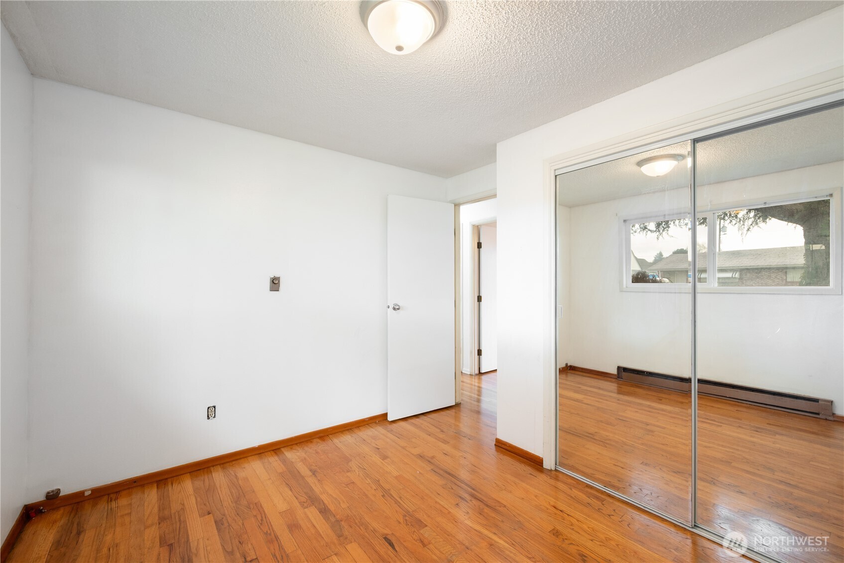 359 Douglas Street Longview, WA 98632 - Photo 23 of 29 wooden floor in an empty room