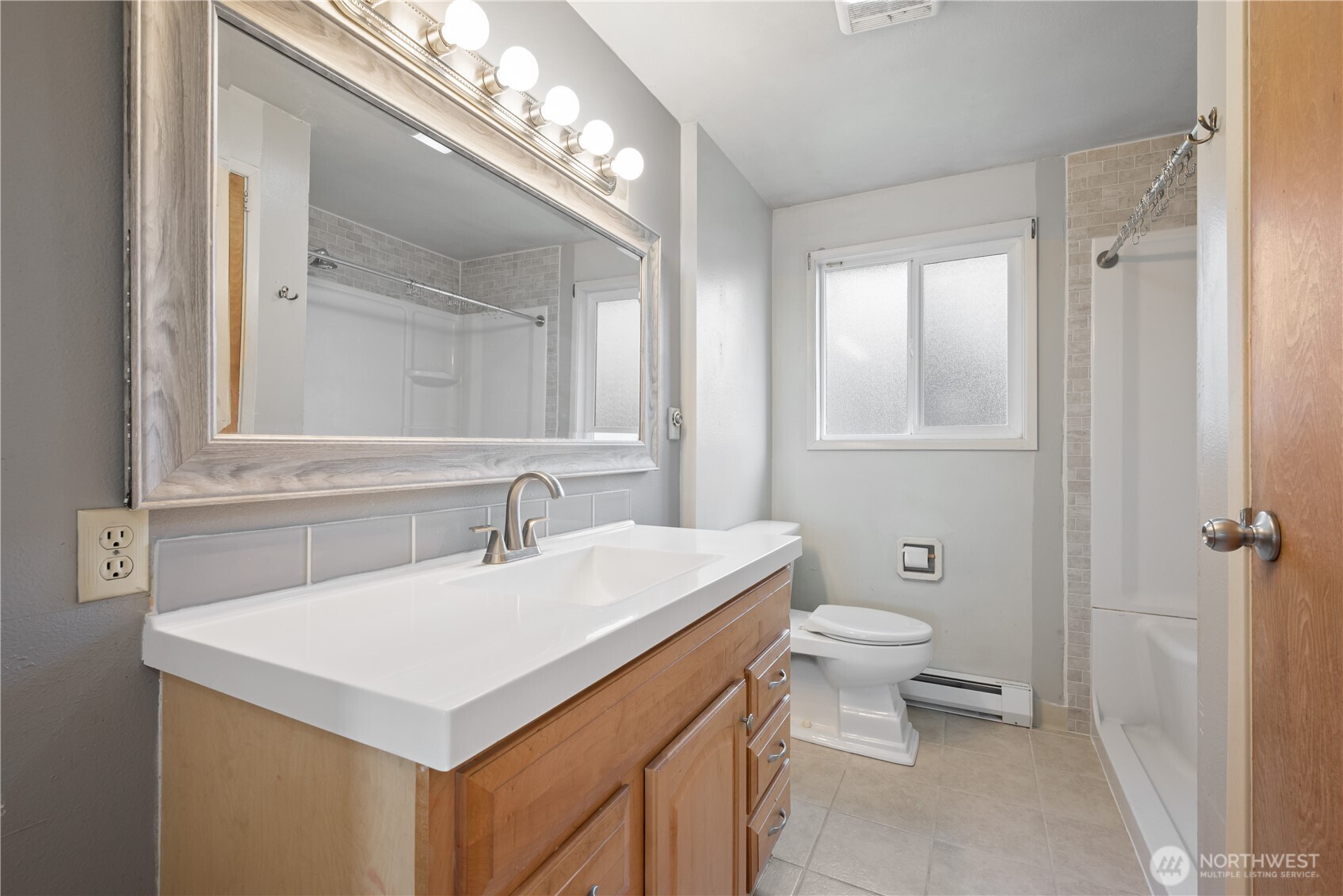 359 Douglas Street Longview, WA 98632 - Photo 24 of 29 a bathroom with a sink and a toilet
