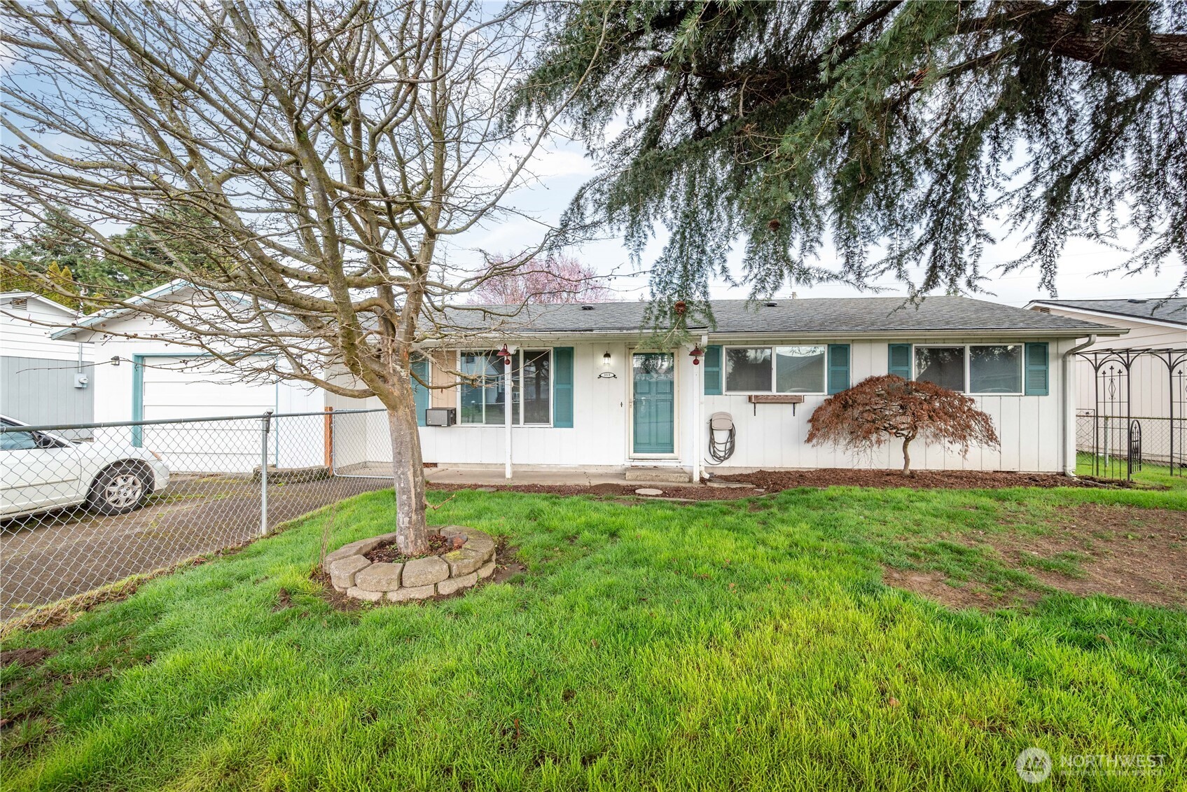 359 Douglas Street Longview, WA 98632 - Photo 3 of 29 a front view of a house with table and chairs