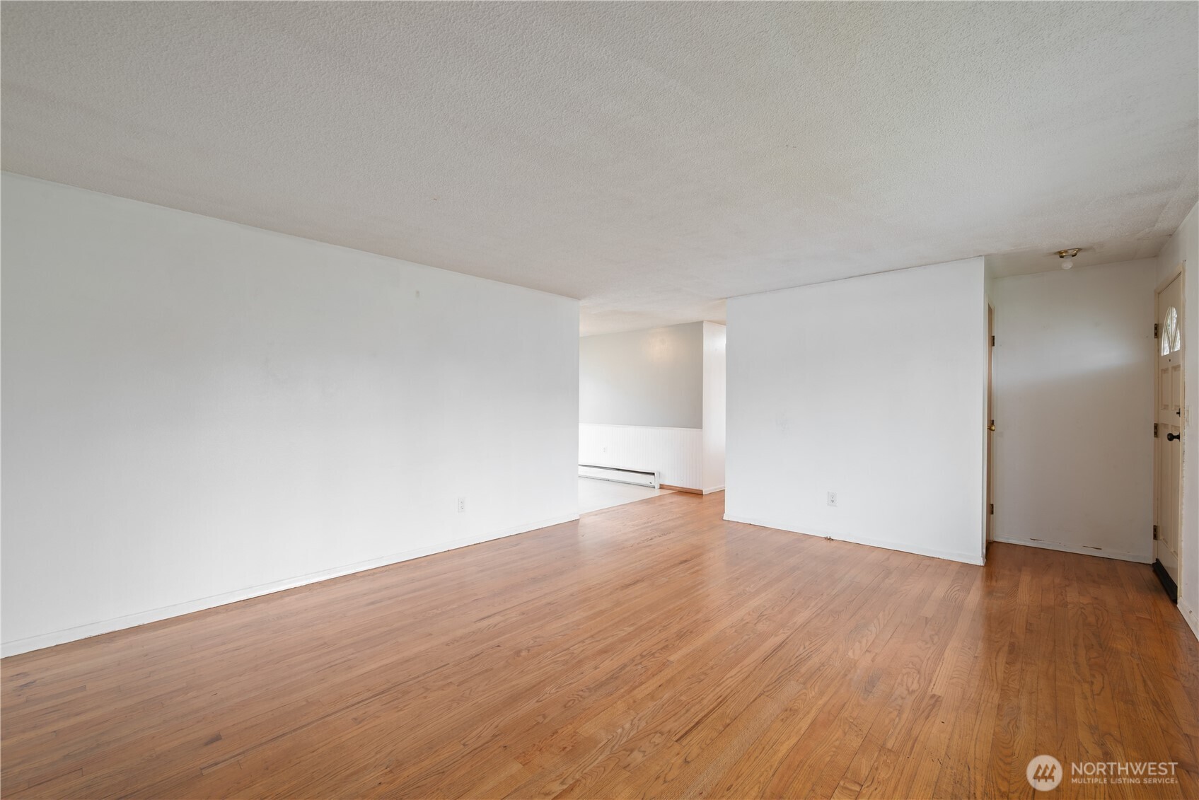 359 Douglas Street Longview, WA 98632 - Photo 6 of 29 a view of an empty room with wooden floor