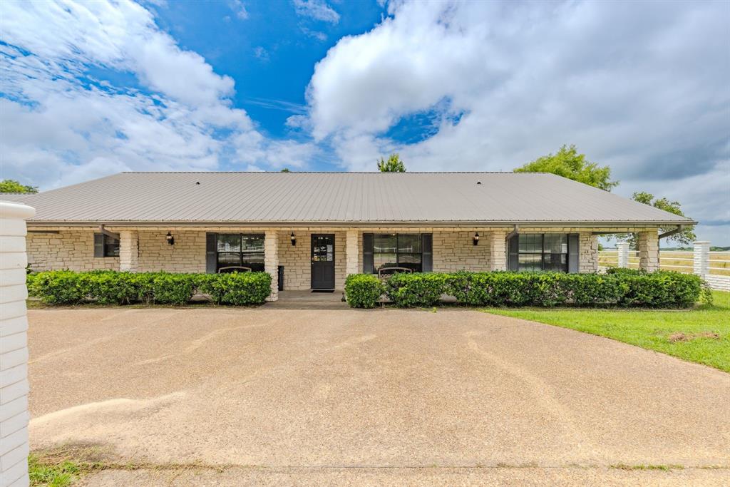 4509 Diamond D Road Lone Oak, TX 75453 - Photo 30 of 36 a front view of house with yard and green space
