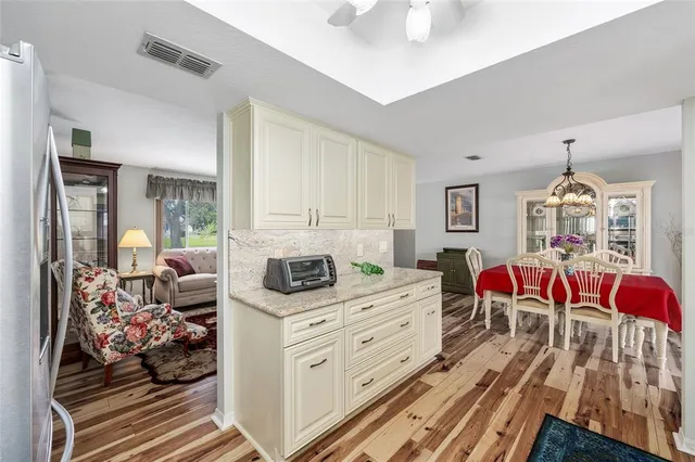 a bedroom with furniture and a wooden floor