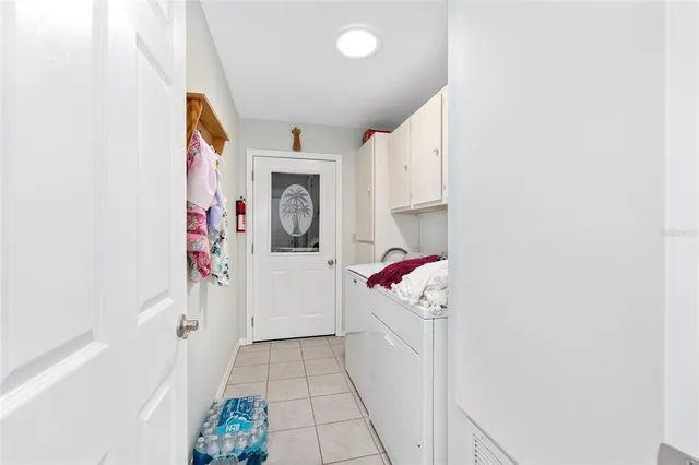 a bedroom with bed and a chandelier