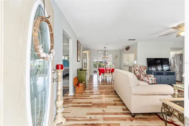 a view of a living room and a baby crib