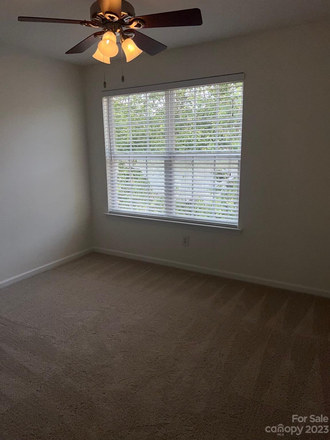 968 Copperstone Lane Fort Mill, SC 29708 - Photo 11 of 13 an empty room with a window and a fan