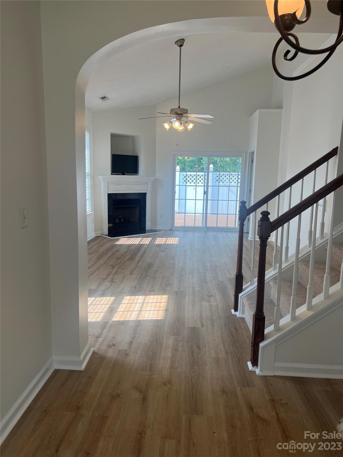 968 Copperstone Lane Fort Mill, SC 29708 - Photo 2 of 13 a view of an empty room with wooden floor fireplace and a window