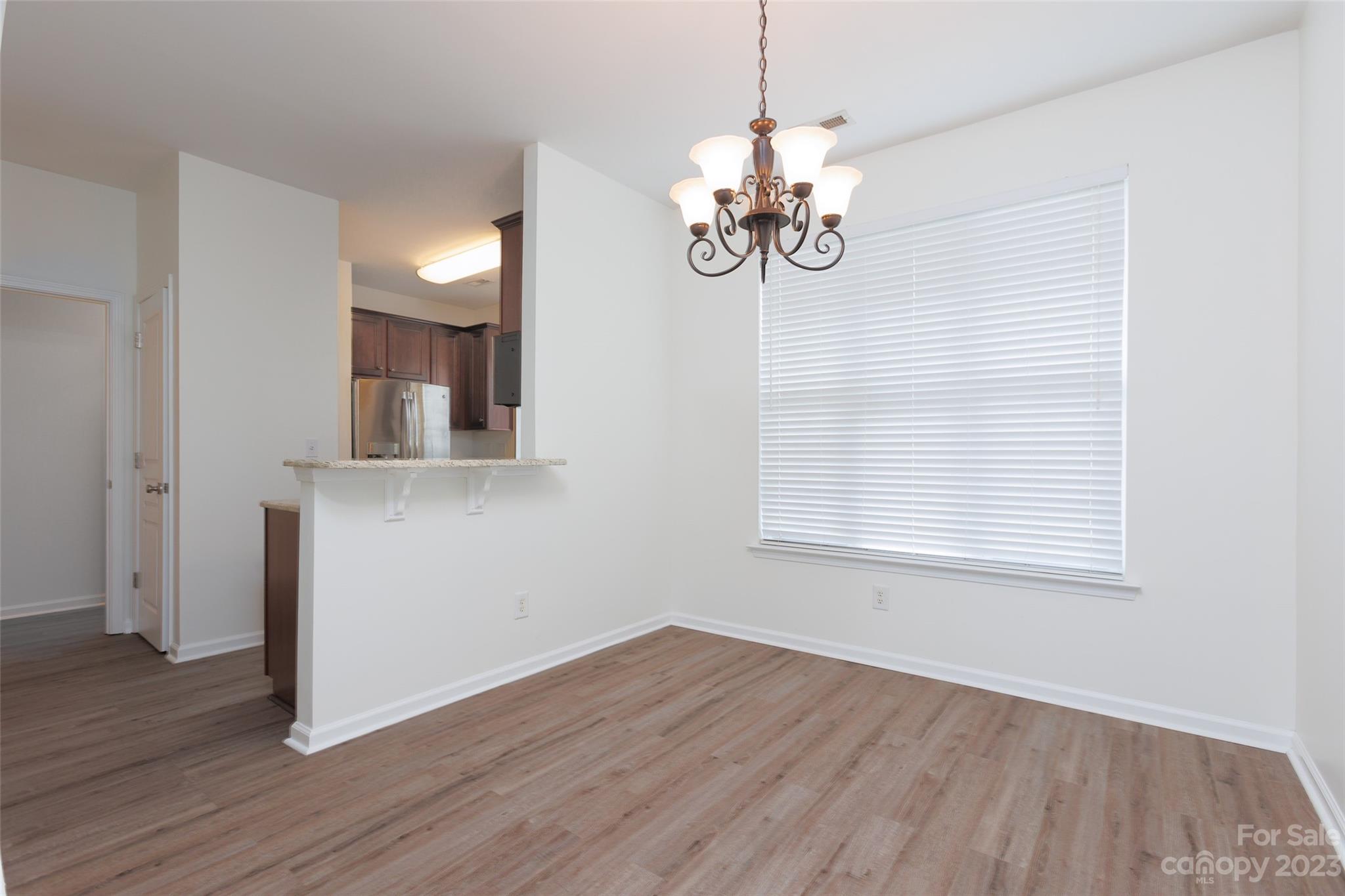 968 Copperstone Lane Fort Mill, SC 29708 - Photo 4 of 13 a view of a room with wooden floor and window