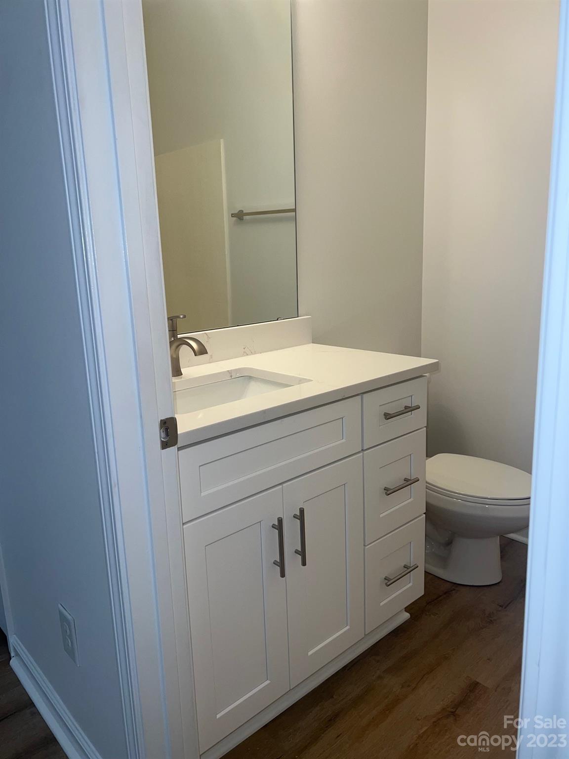 968 Copperstone Lane Fort Mill, SC 29708 - Photo 9 of 13 a bathroom with a sink a toilet and vanity