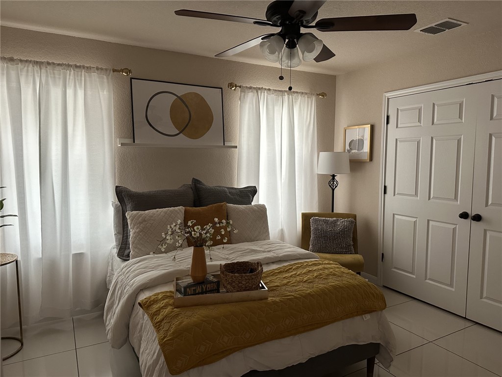 527 Coyote Ranch Alice, TX 78332 - Photo 13 of 17 a bedroom with a bed a mirror and furniture