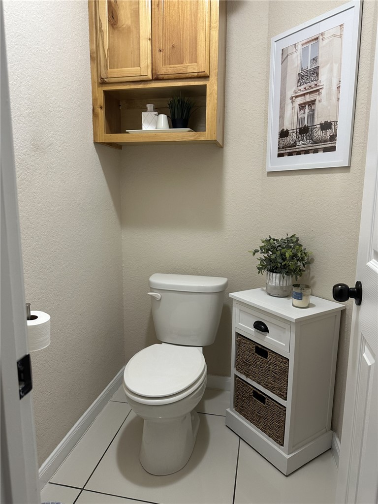 527 Coyote Ranch Alice, TX 78332 - Photo 15 of 17 a white toilet sitting next to a bathroom sink