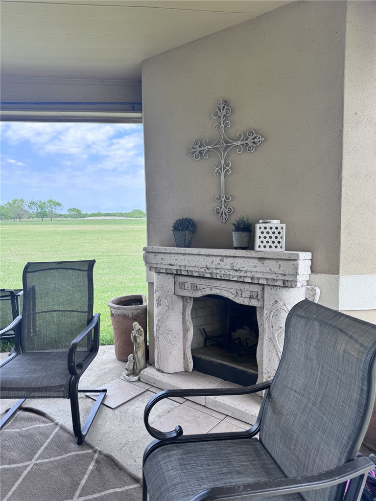 527 Coyote Ranch Alice, TX 78332 - Photo 16 of 17 a living room with furniture and a fireplace