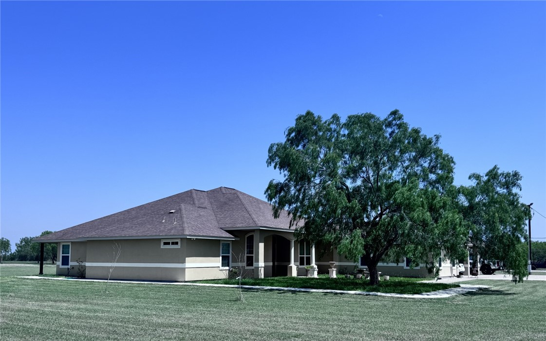 527 Coyote Ranch Alice, TX 78332 - Photo 2 of 17 a front view of a house with a garden
