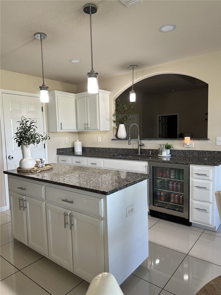 527 Coyote Ranch Alice, TX 78332 - Photo 10 of 17 a kitchen with stainless steel appliances granite countertop a sink and a stove