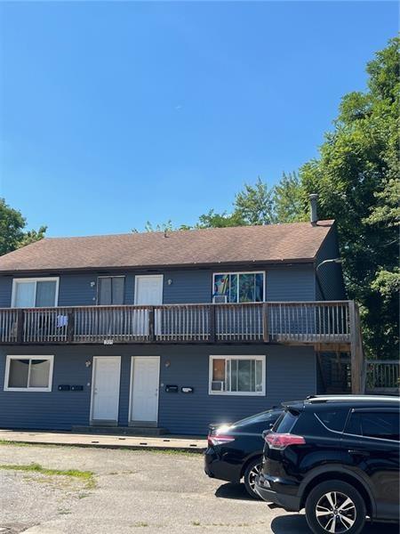 301 West Maiden Street Washington, PA 15301 - Photo 2 of 14 a front view of a house with a garden