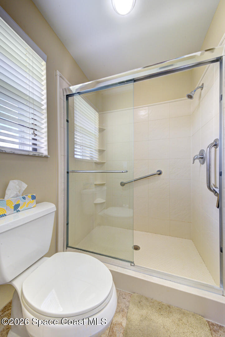 1142 Keystone Drive, Unit F Jupiter, FL 33458 - Photo 27 of 43 primary bathroom shower