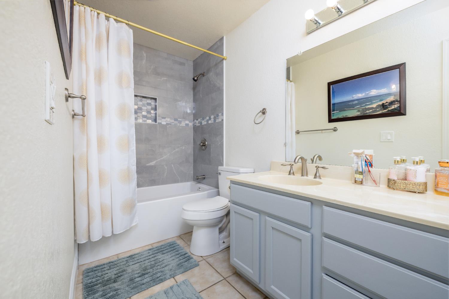 2909 Huntington Boulevard, Unit 133 Fresno, CA 93721 - Photo 8 of 19 a bathroom with a sink a toilet and shower