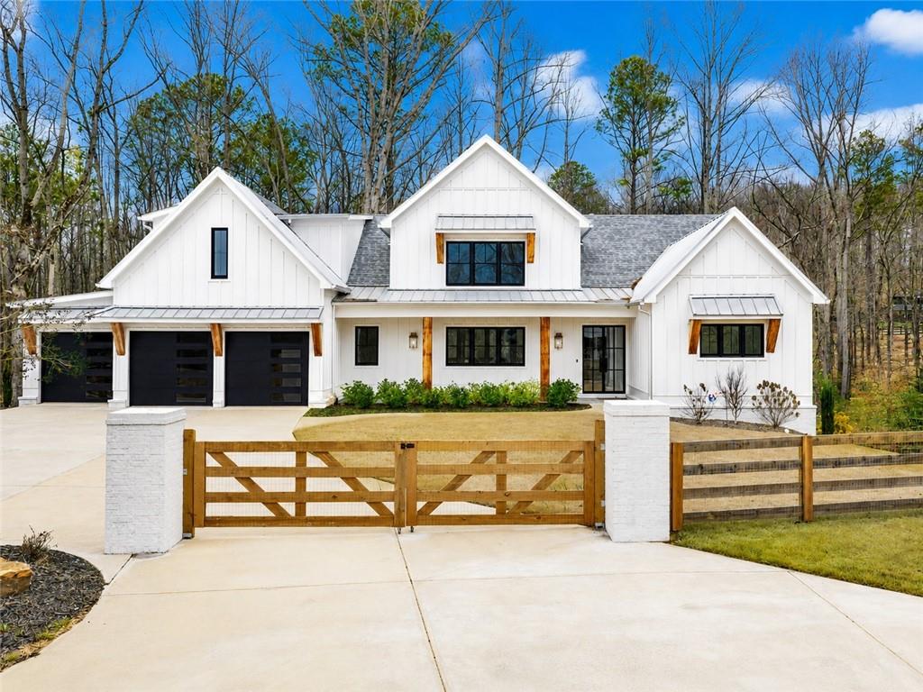 555 Lower Birmingham Road Canton, GA 30115 - Photo 3 of 104 a front view of a house with a yard
