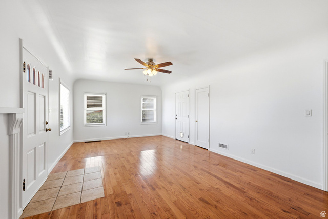1925 South Main Street Bountiful, UT 84010 - Photo 8 of 48 Spacious interior featuring wood-finish flooring, white walls, and a ceiling fan with integrated lighting