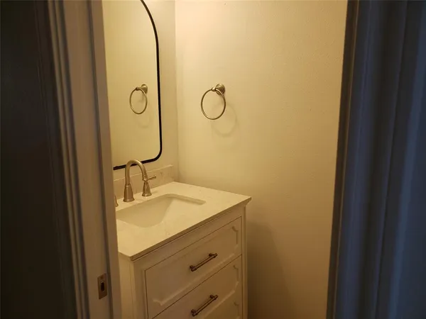 a white toilet sitting next to a blue sink