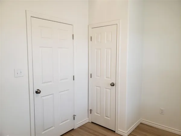 a view of a bathroom from a hallway