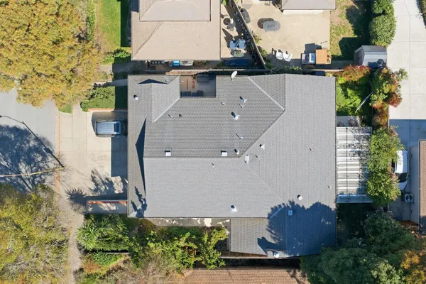 an aerial view of a house with outdoor space