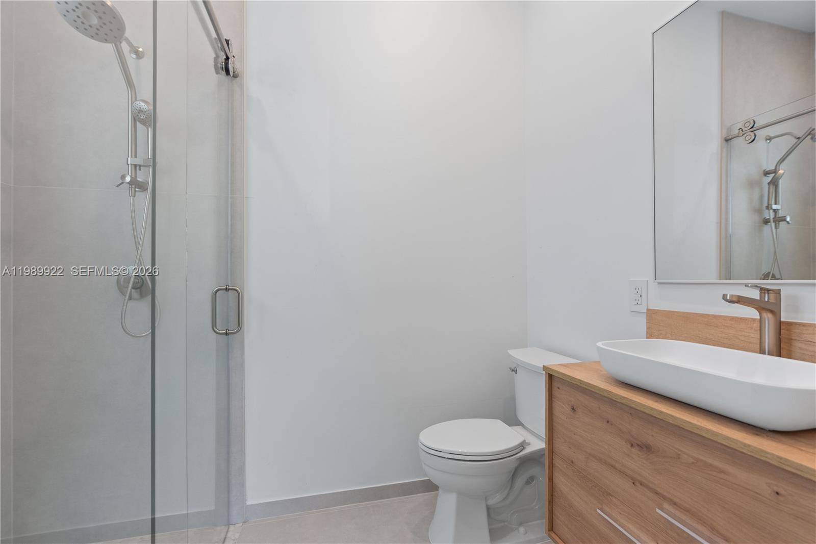 6221 Southwest 60th Street South Miami, FL 33143 - Photo 23 of 42 a bathroom with a sink a toilet and shower